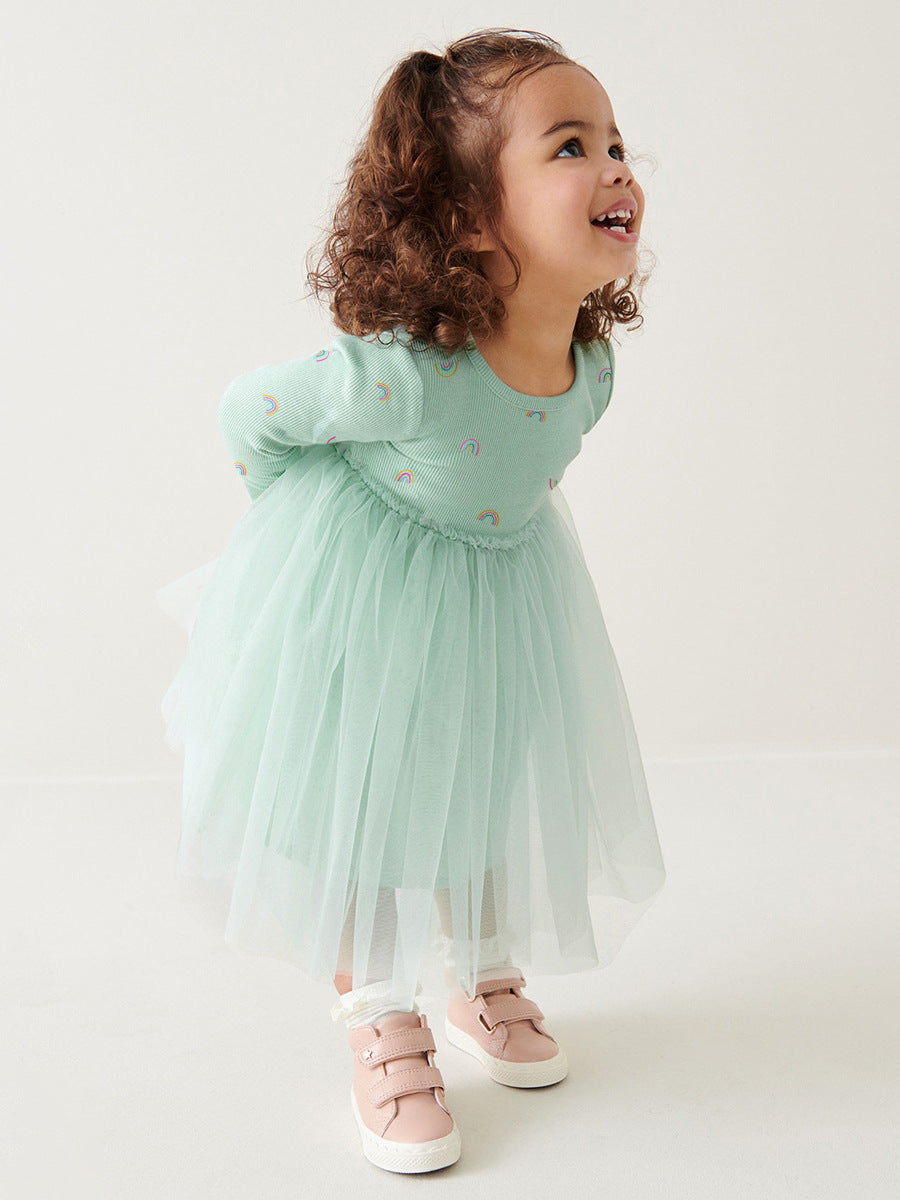 A vibrant green crew neck tulle top featuring a colorful rainbow print, perfect for girls aged 12 months to 10 years.