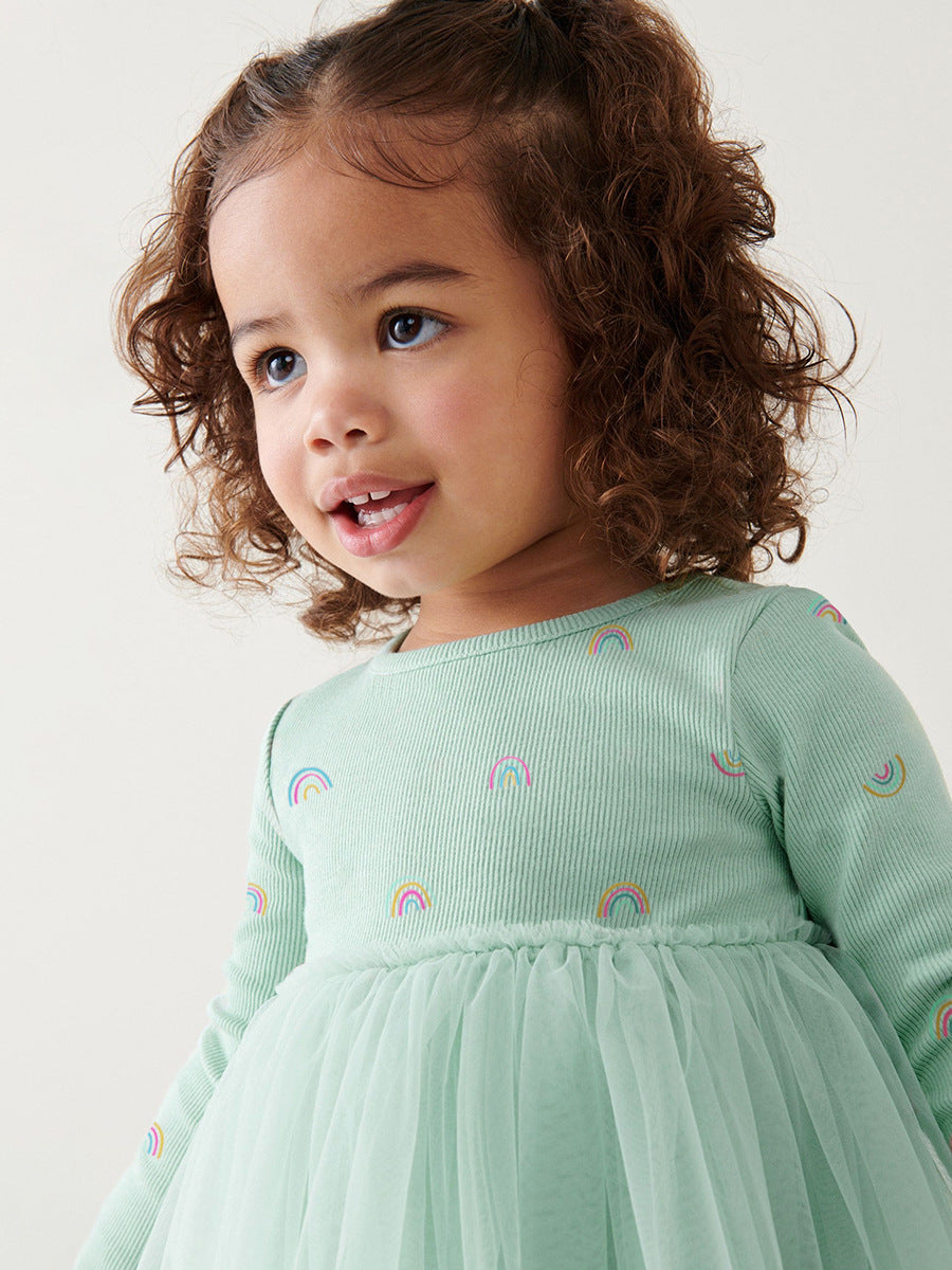 A vibrant green crew neck tulle top featuring a colorful rainbow print, perfect for girls aged 12 months to 10 years.