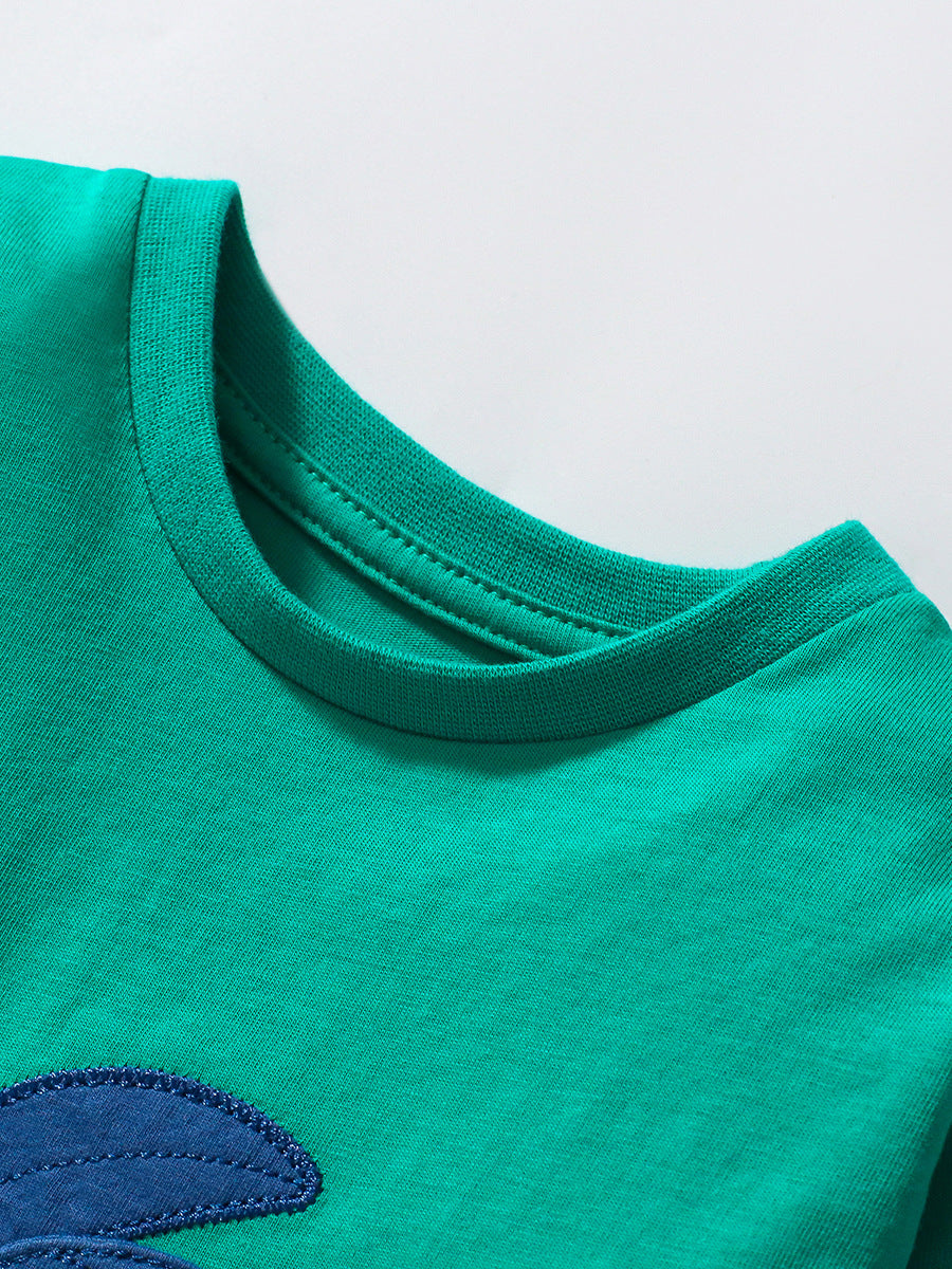 Green long sleeve t-shirt for kids featuring a cute little dragon pattern, made from soft cotton material.