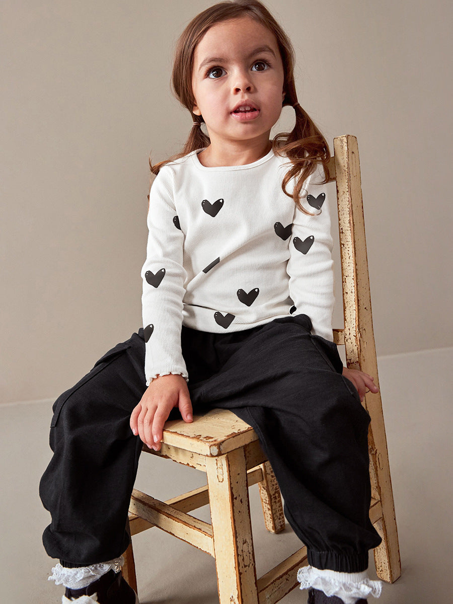 Girls casual black long sleeve shirt with heart print, perfect for spring and autumn wear.