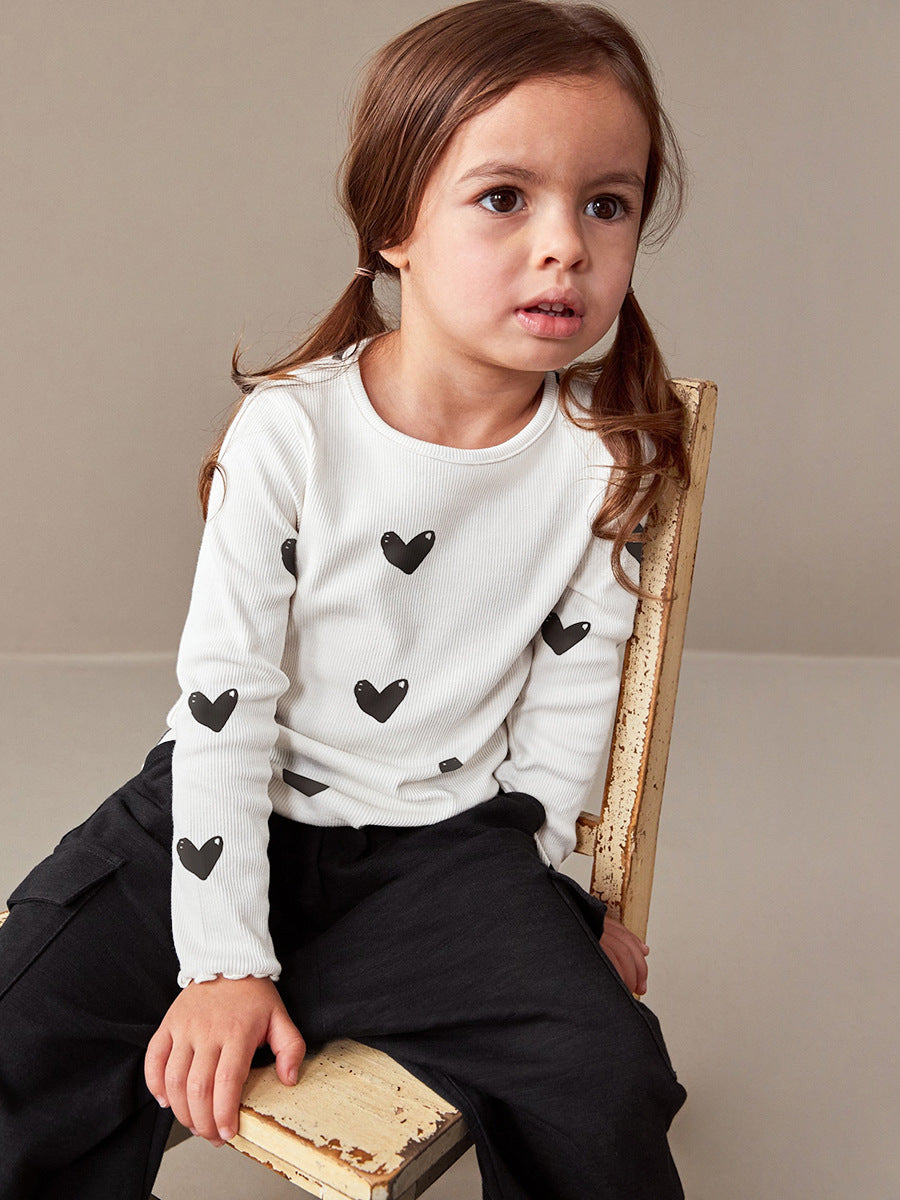 Girls casual black long sleeve shirt with heart print, perfect for spring and autumn wear.