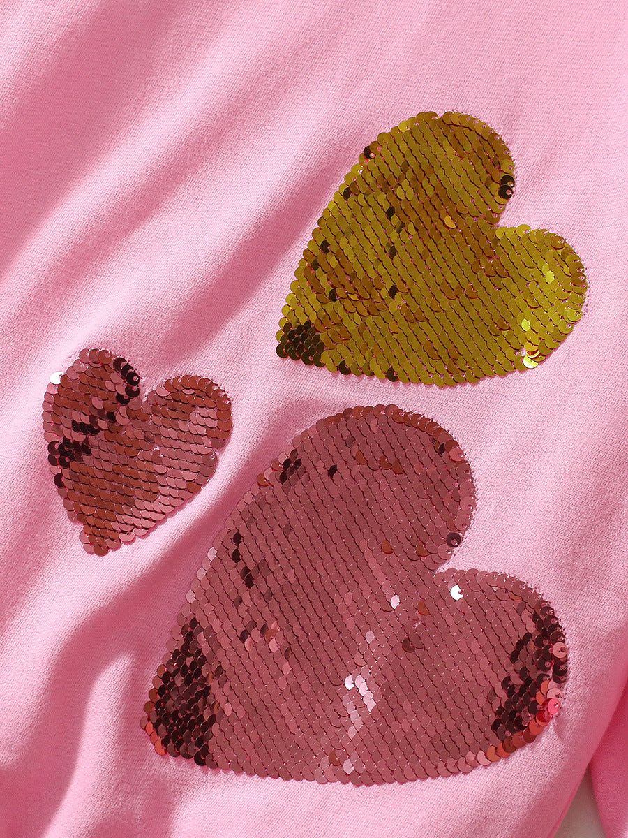 Pink long sleeves top for girls featuring a sequin heart design, made from cotton and polyester, perfect for spring and autumn wear.