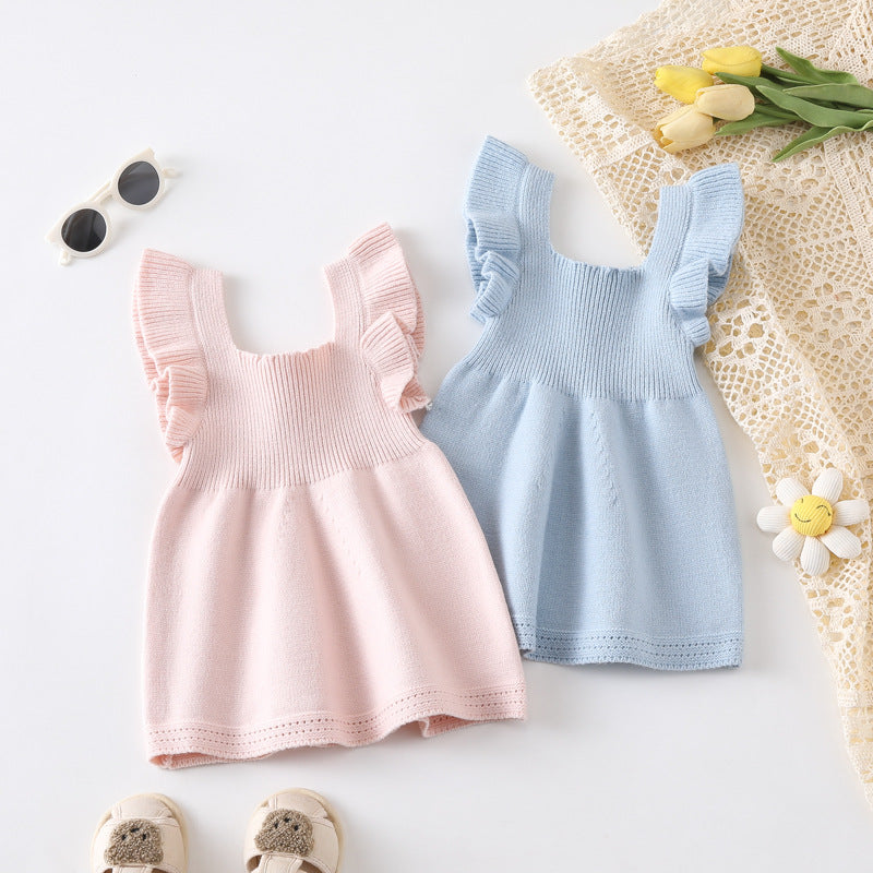 A cute summer top for baby girls featuring fly sleeves in solid pink and blue colors, made from soft cotton and polyester.