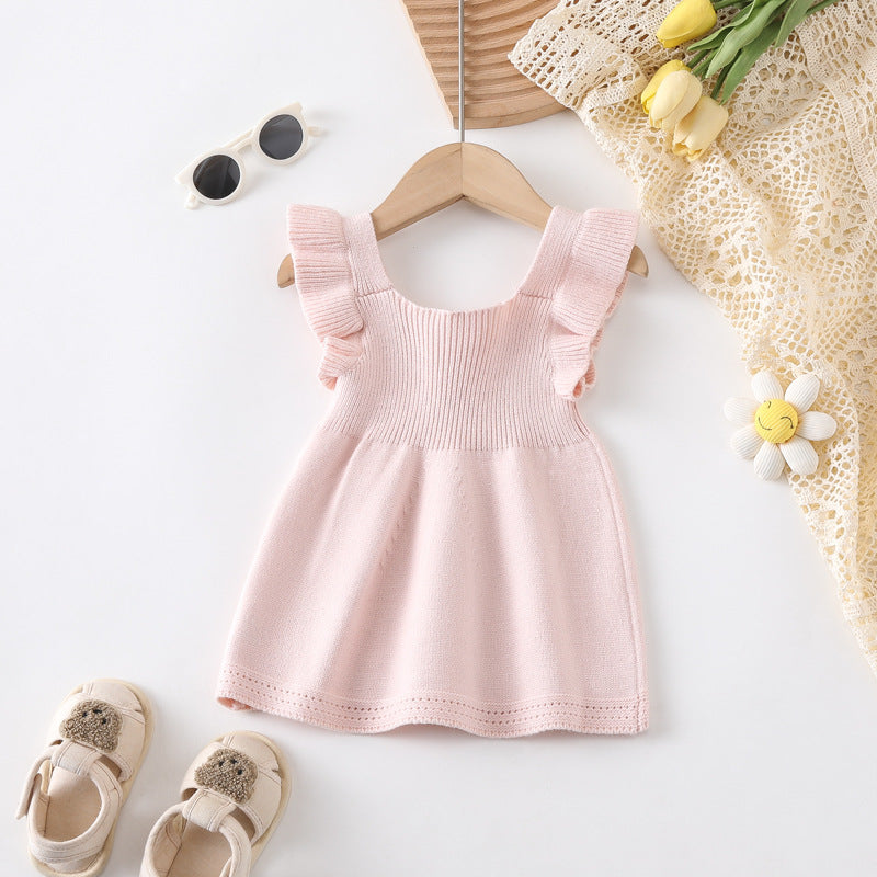 A cute summer top for baby girls featuring fly sleeves in solid pink and blue colors, made from soft cotton and polyester.