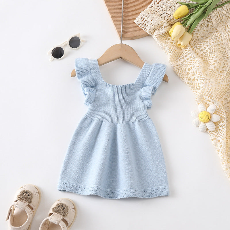 A cute summer top for baby girls featuring fly sleeves in solid pink and blue colors, made from soft cotton and polyester.