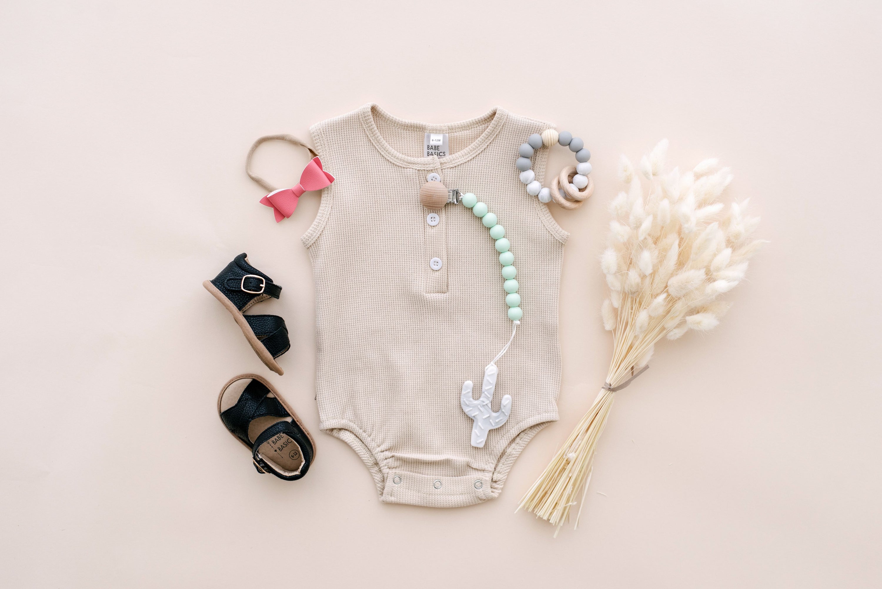 Arizona Sleeveless Romper in sunset hues, made from soft waffle cotton, perfect for babies.