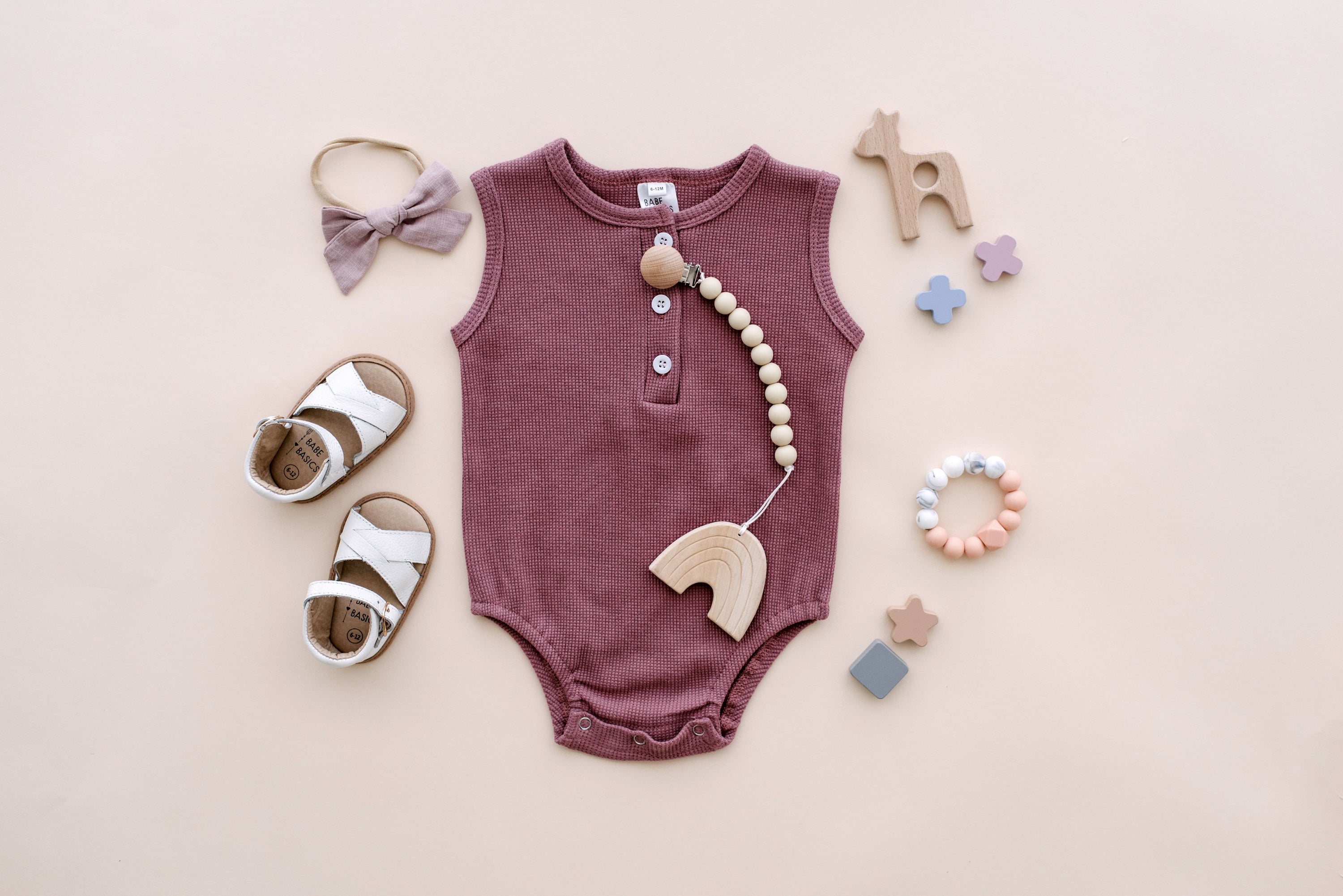 Arizona Sleeveless Romper in sunset hues, made from soft waffle cotton, perfect for babies.