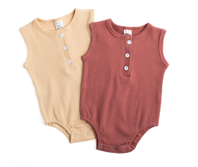 Arizona Sleeveless Romper in sunset hues, made from soft waffle cotton, perfect for babies.