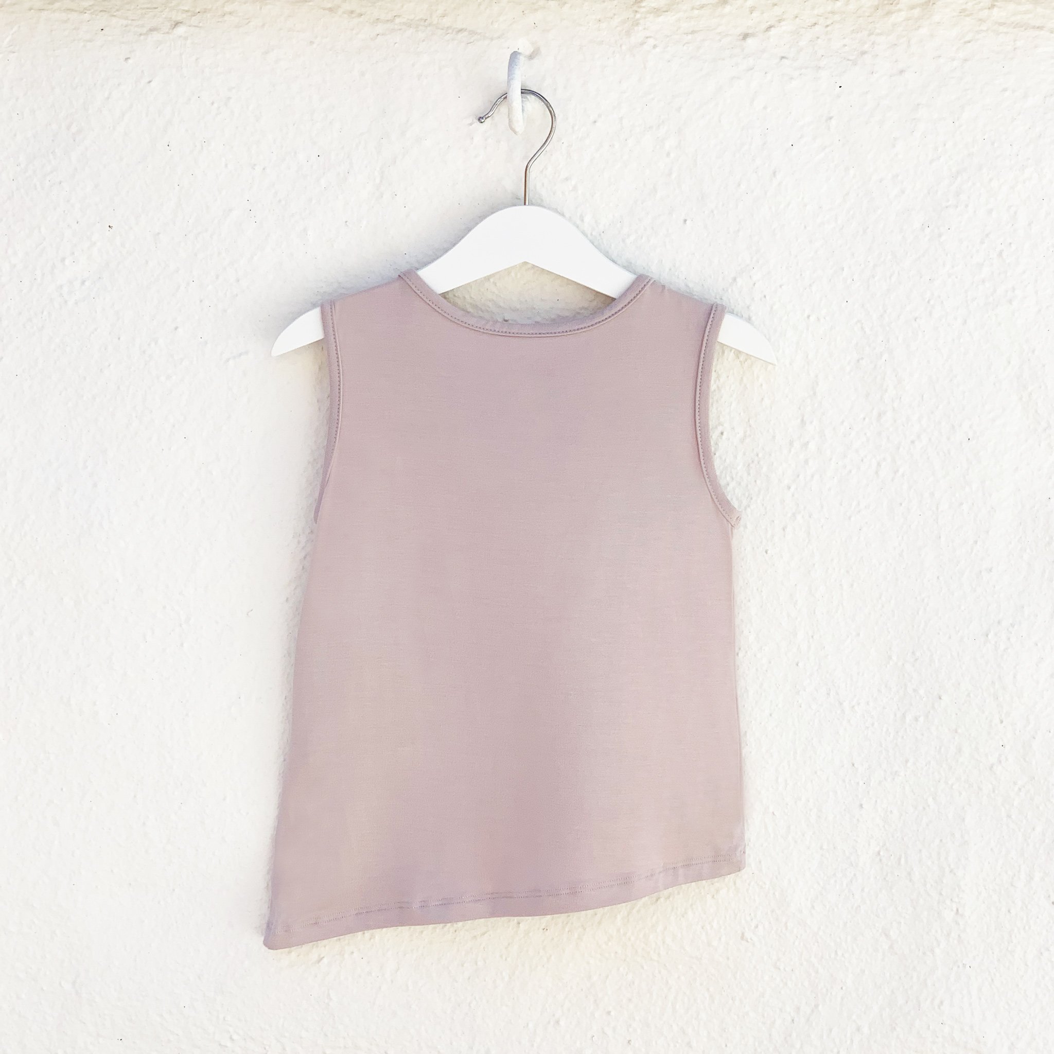 Asymmetric Tank in Mocha featuring a unique hem and monster pocket, made from soft rayon modal fabric.