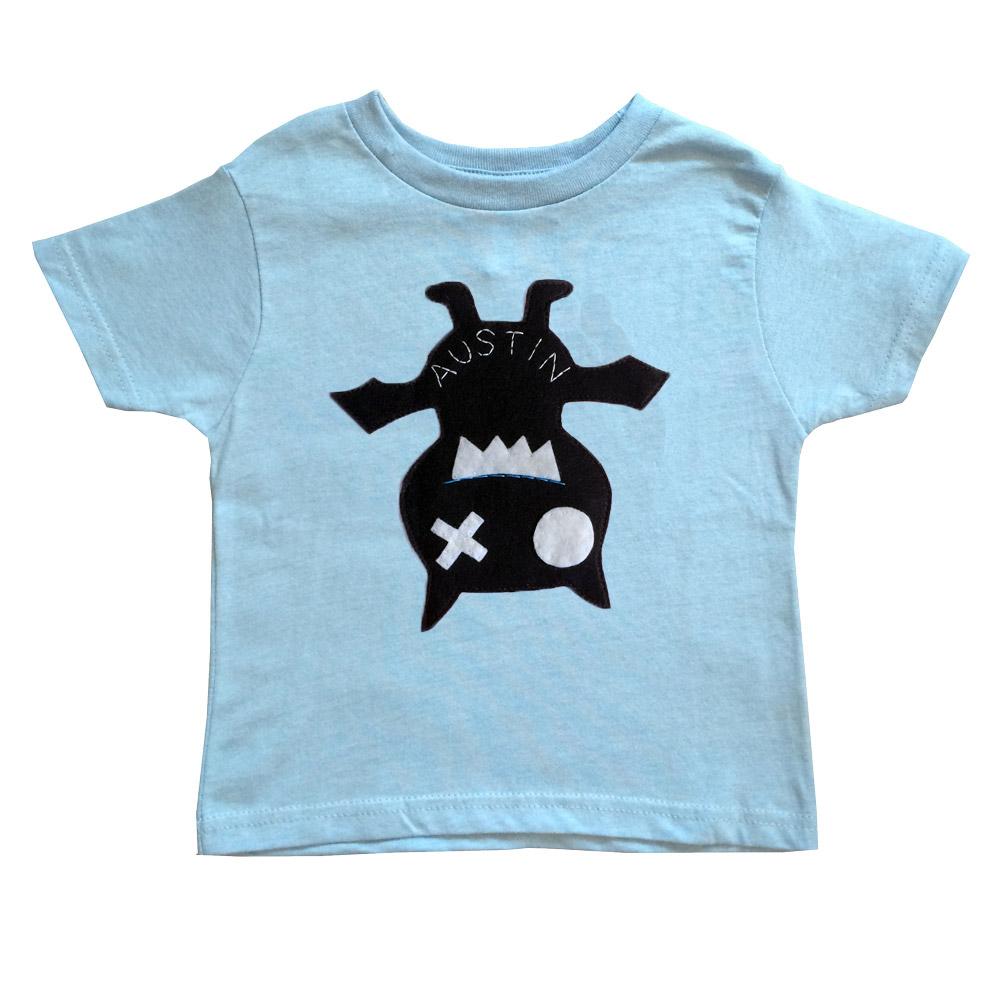 A handmade kids shirt featuring a cute bat design, perfect for children, showcasing vibrant colors and soft fabric.