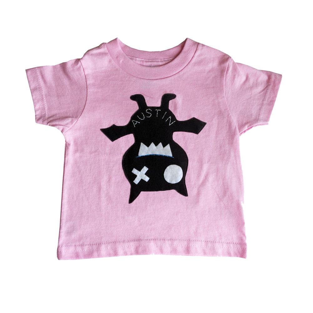 A handmade kids shirt featuring a cute bat design, perfect for children, showcasing vibrant colors and soft fabric.