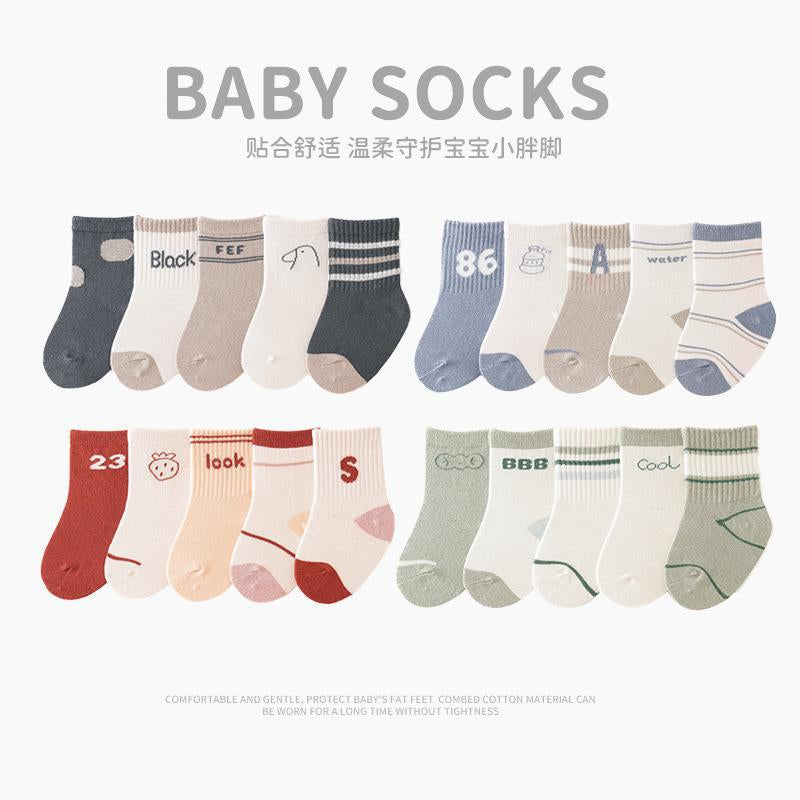 A collection of colorful baby socks featuring cartoon prints in pink, blue, green, yellow, and grey, suitable for both boys and girls.