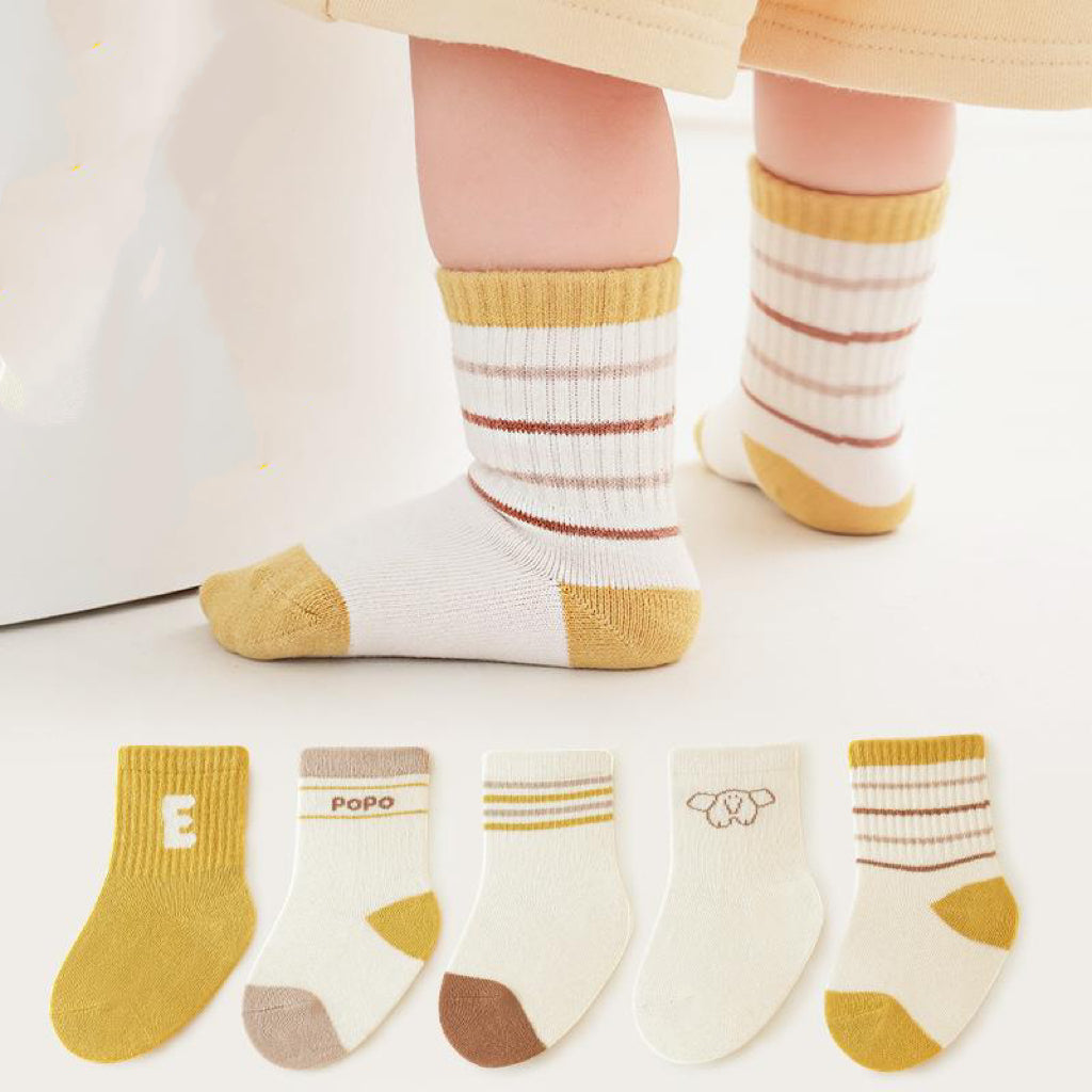 A collection of colorful baby socks featuring cartoon prints in pink, blue, green, yellow, and grey, suitable for both boys and girls.