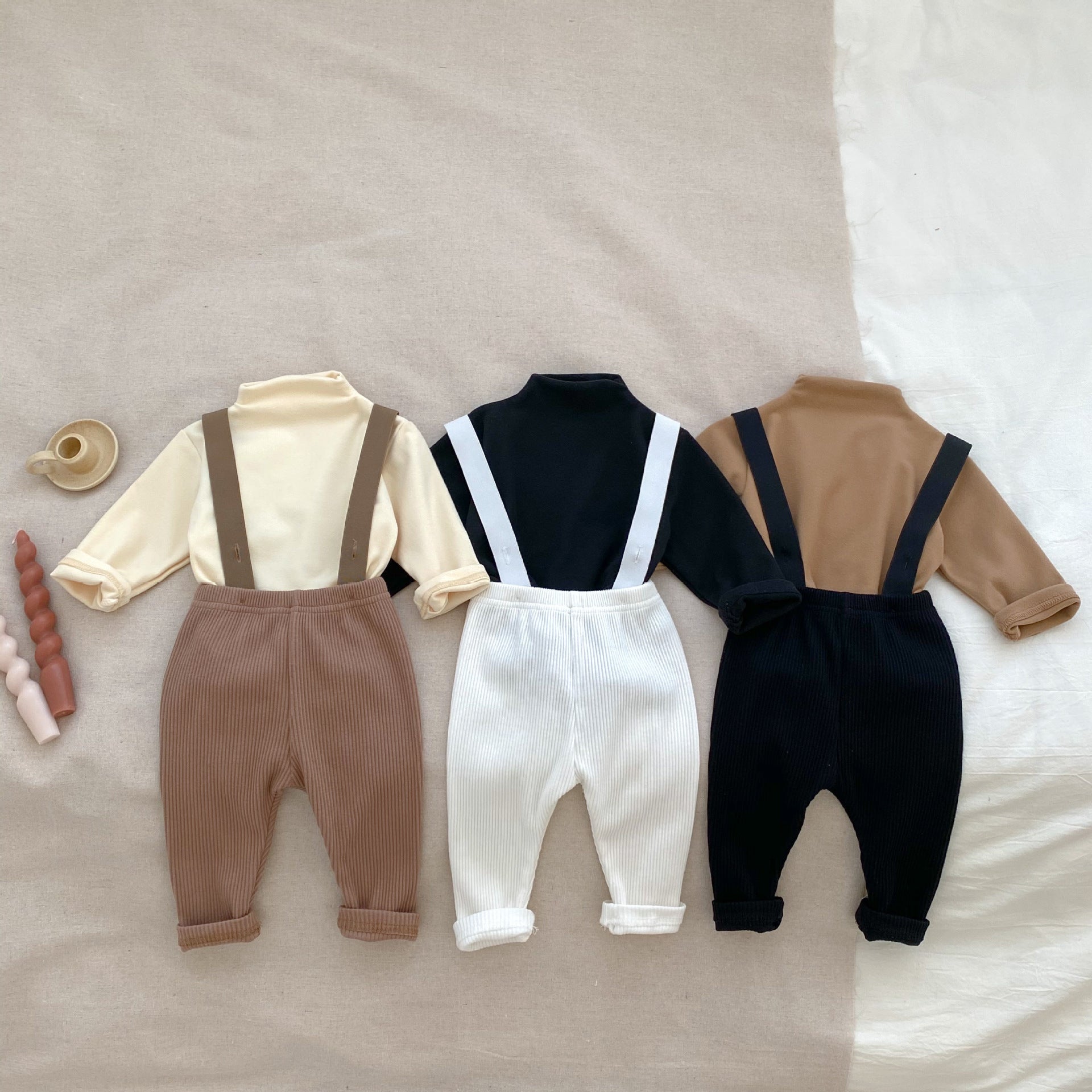 A stylish Autumn Casual Solid Color Long Sleeve Set for babies, featuring a soft cotton fabric in white, black, and coffee colors.