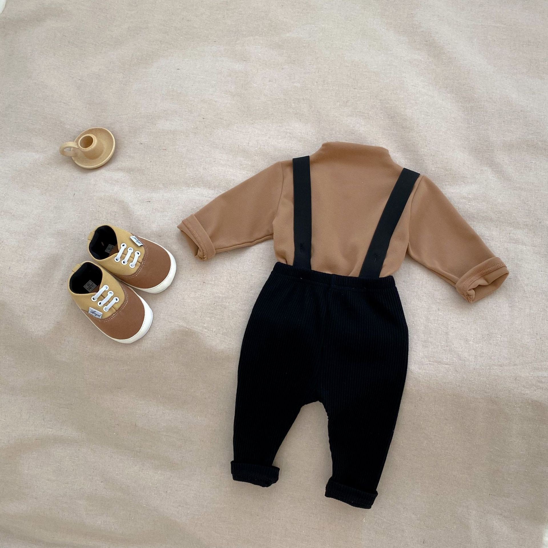 A stylish Autumn Casual Solid Color Long Sleeve Set for babies, featuring a soft cotton fabric in white, black, and coffee colors.