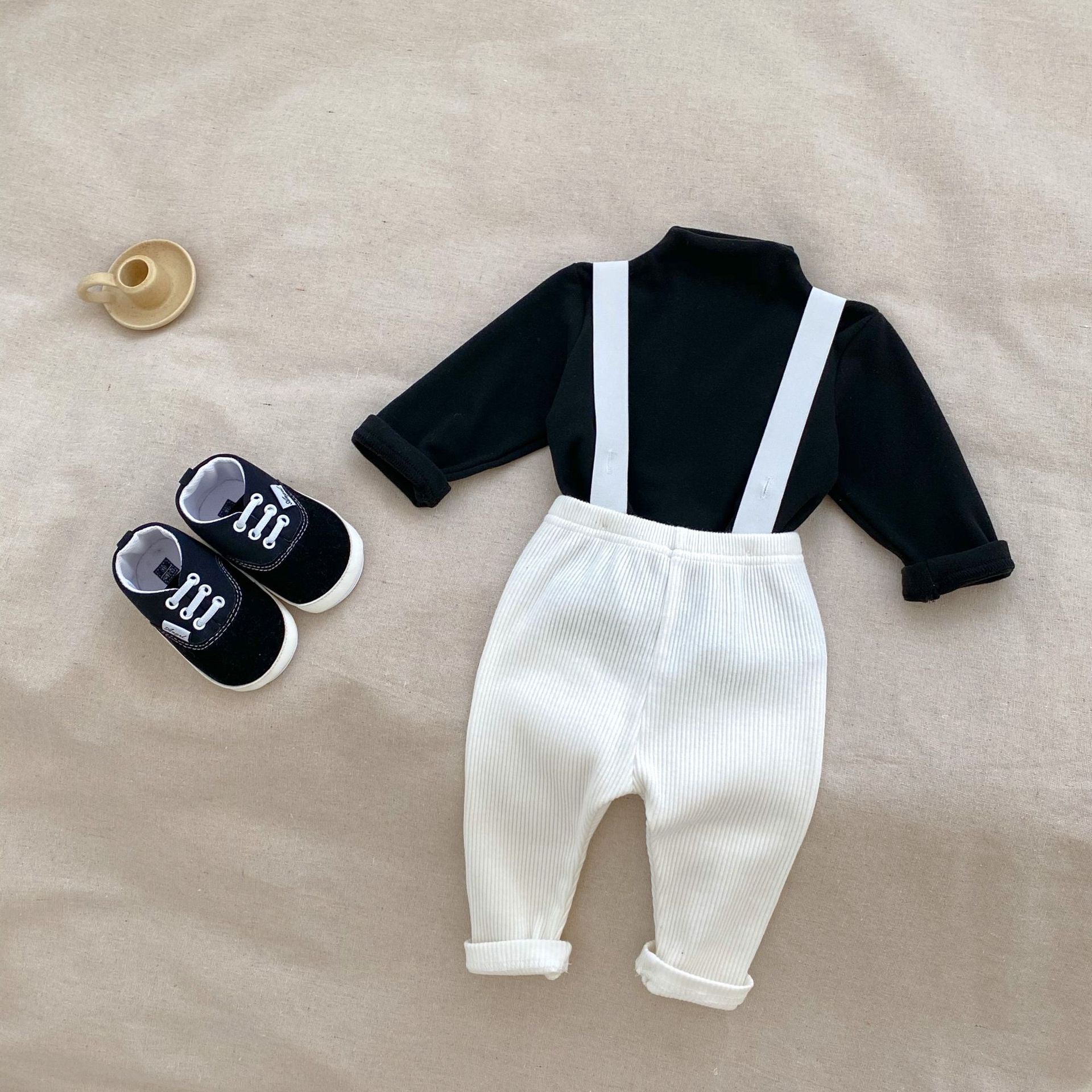 A stylish Autumn Casual Solid Color Long Sleeve Set for babies, featuring a soft cotton fabric in white, black, and coffee colors.