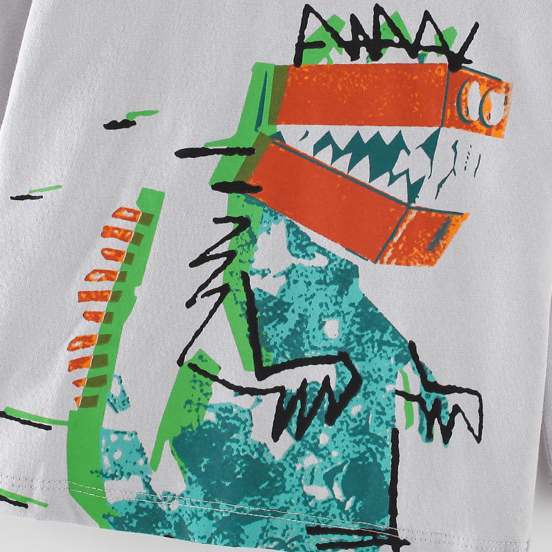 A grey crewneck shirt featuring a playful dinosaur pattern, perfect for boys aged 12 months to 10 years.