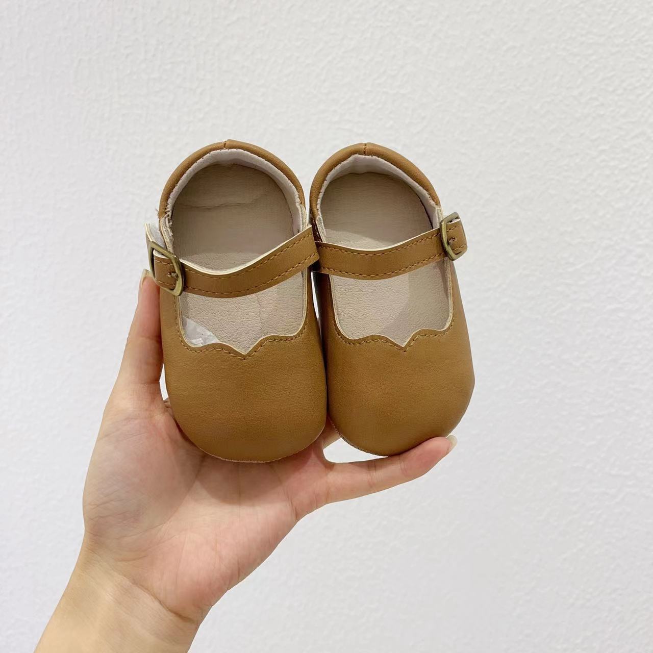 Autumn Fashion Baby Girl Solid Color Leather Toddler Shoes in white, black, khaki, and brown, showcasing their stylish design and quality material.