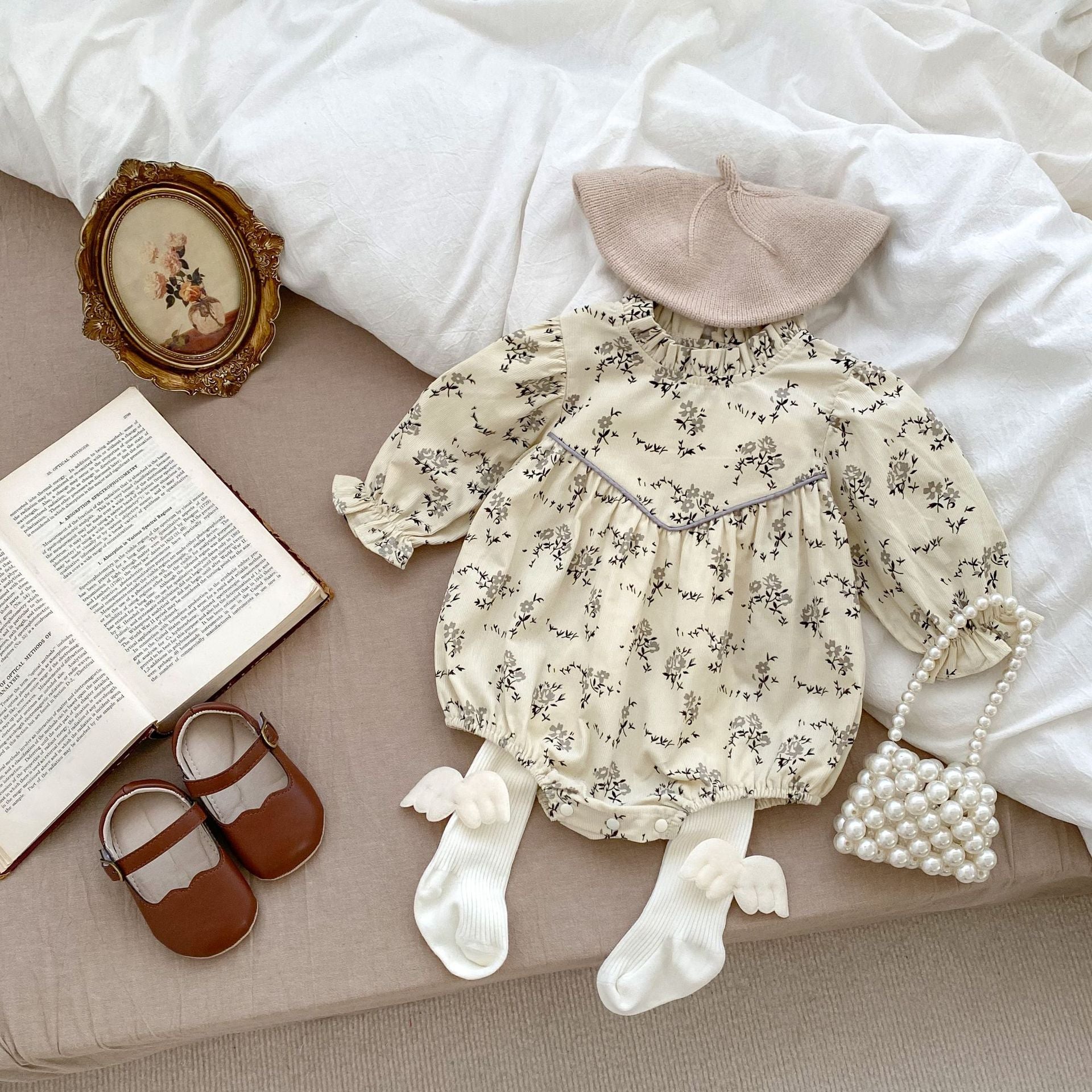 Autumn Floral Pattern Fashion Triangle Onesies in beige and brown for baby girls, showcasing a charming floral design.