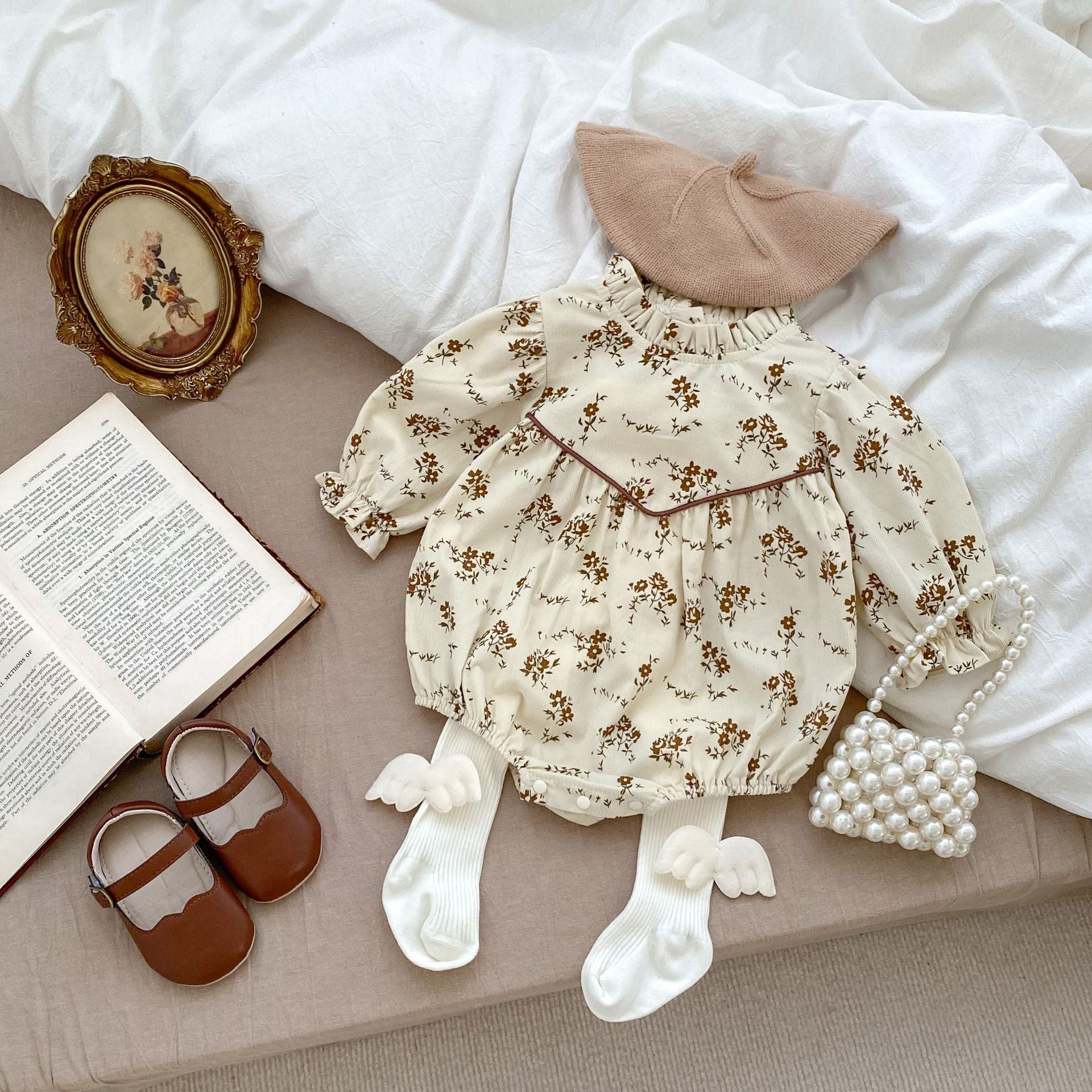 Autumn Floral Pattern Fashion Triangle Onesies in beige and brown for baby girls, showcasing a charming floral design.