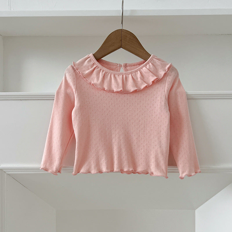 A collection of soft cotton outfits for baby girls in pink, blue, and apricot colors, perfect for autumn wear.