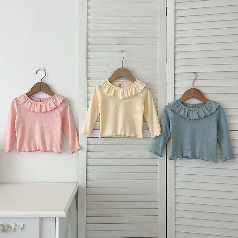 A collection of soft cotton outfits for baby girls in pink, blue, and apricot colors, perfect for autumn wear.