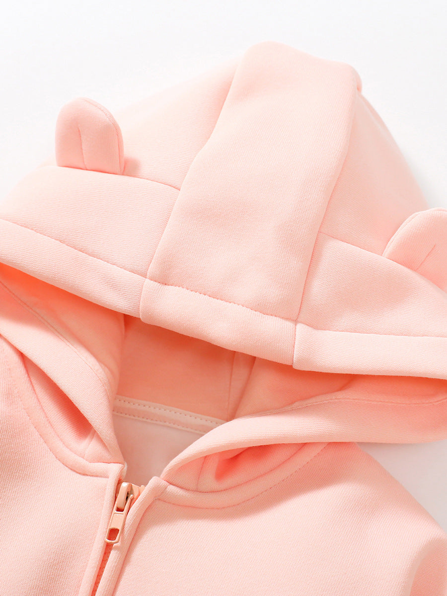 A cozy pink hoodie for baby girls, featuring long sleeves and a solid color design, perfect for autumn and winter wear.