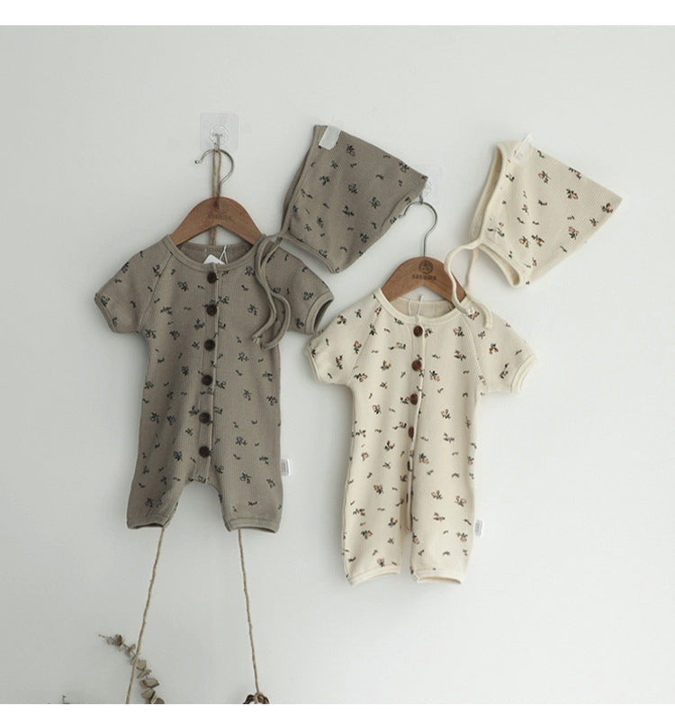 Baby jumpsuit featuring an allover floral graphic pattern and solid bodice, designed for comfort and style.