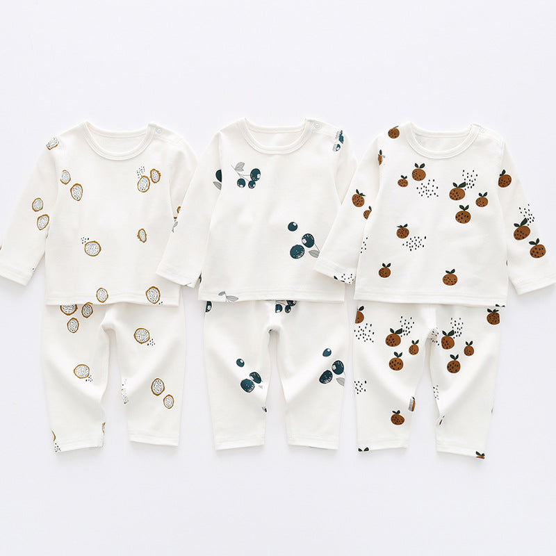 Baby 1pcs set featuring long sleeve shirt and trousers with an allover fruit graphic design, available in white, blue, and brown colors.