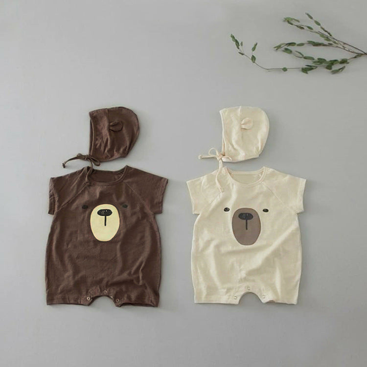 A cute baby wearing a Cartoon Bear Graphic Crotchet Jumpsuit in soft cotton, showcasing the adorable bear design.