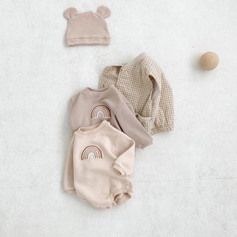 A soft cotton baby bodysuit featuring a rainbow embroidery pattern, available in apricot and coffee colors, designed for comfort and style.