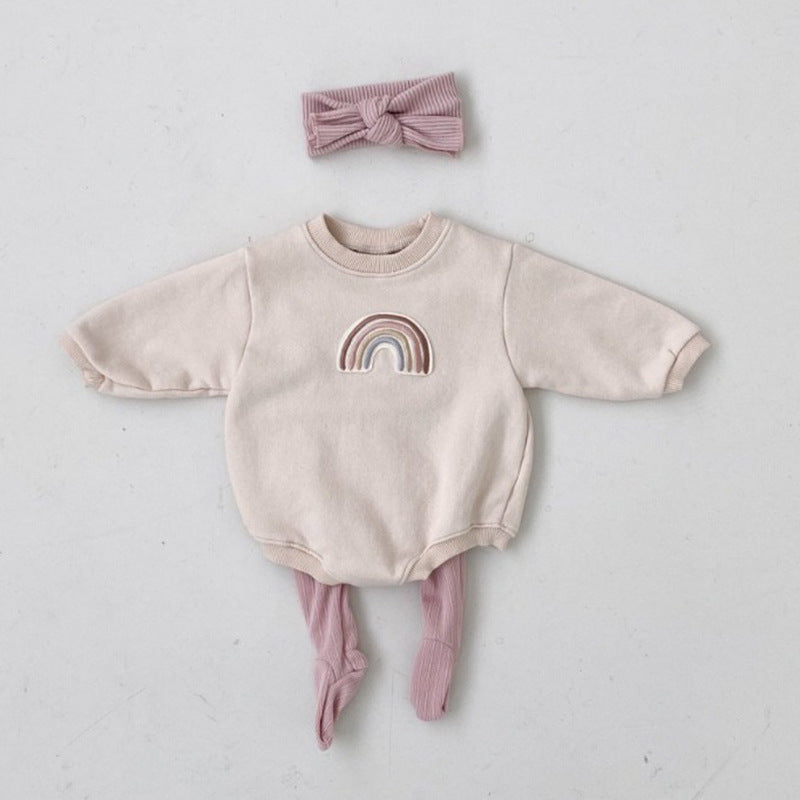 A soft cotton baby bodysuit featuring a rainbow embroidery pattern, available in apricot and coffee colors, designed for comfort and style.