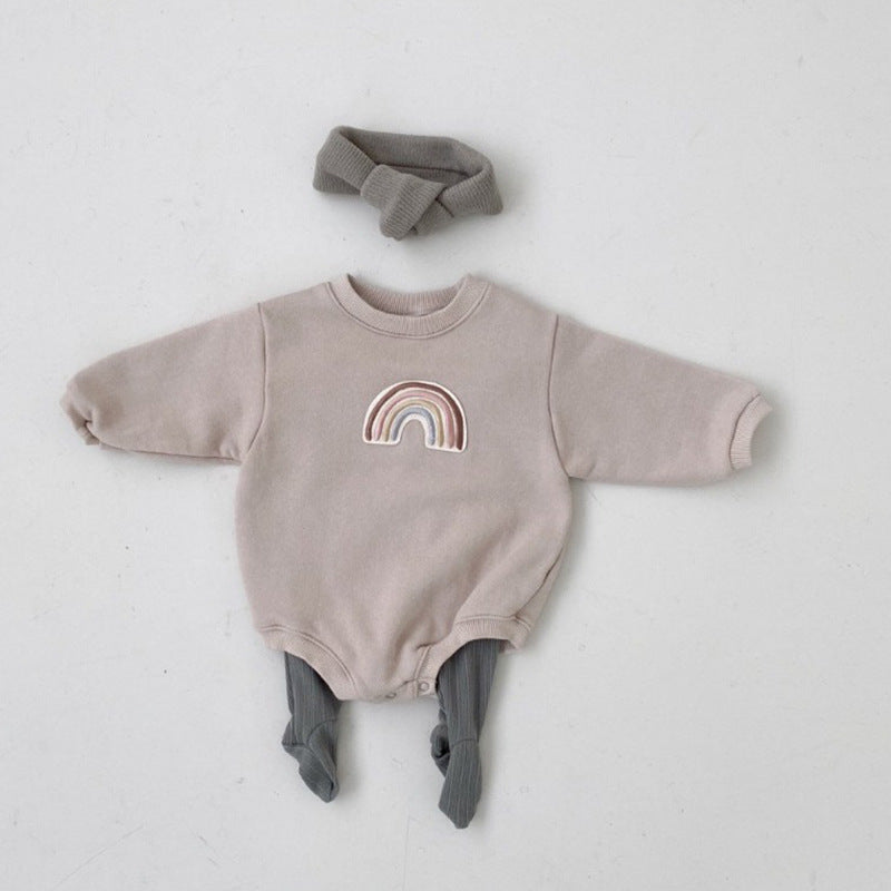 A soft cotton baby bodysuit featuring a rainbow embroidery pattern, available in apricot and coffee colors, designed for comfort and style.