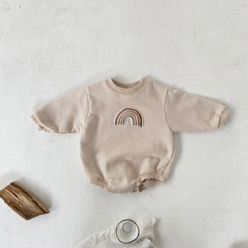 A soft cotton baby bodysuit featuring a rainbow embroidery pattern, available in apricot and coffee colors, designed for comfort and style.