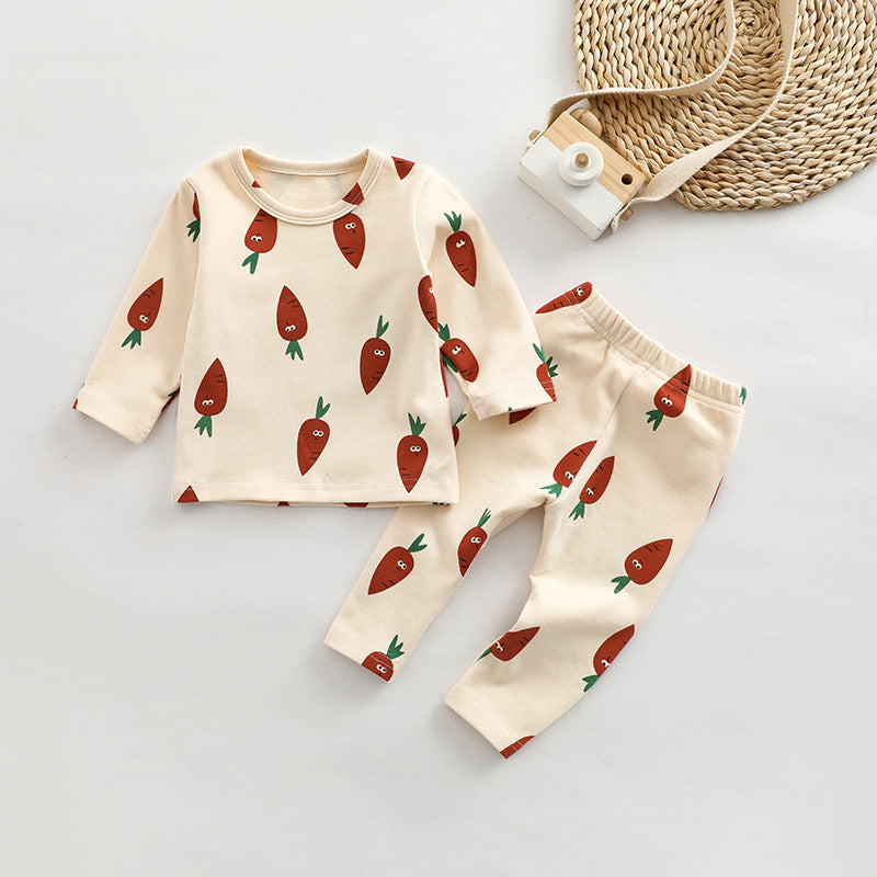 A cute baby outfit set featuring all-over print patterns in pink, yellow, and apricot colors, made from soft cotton material.