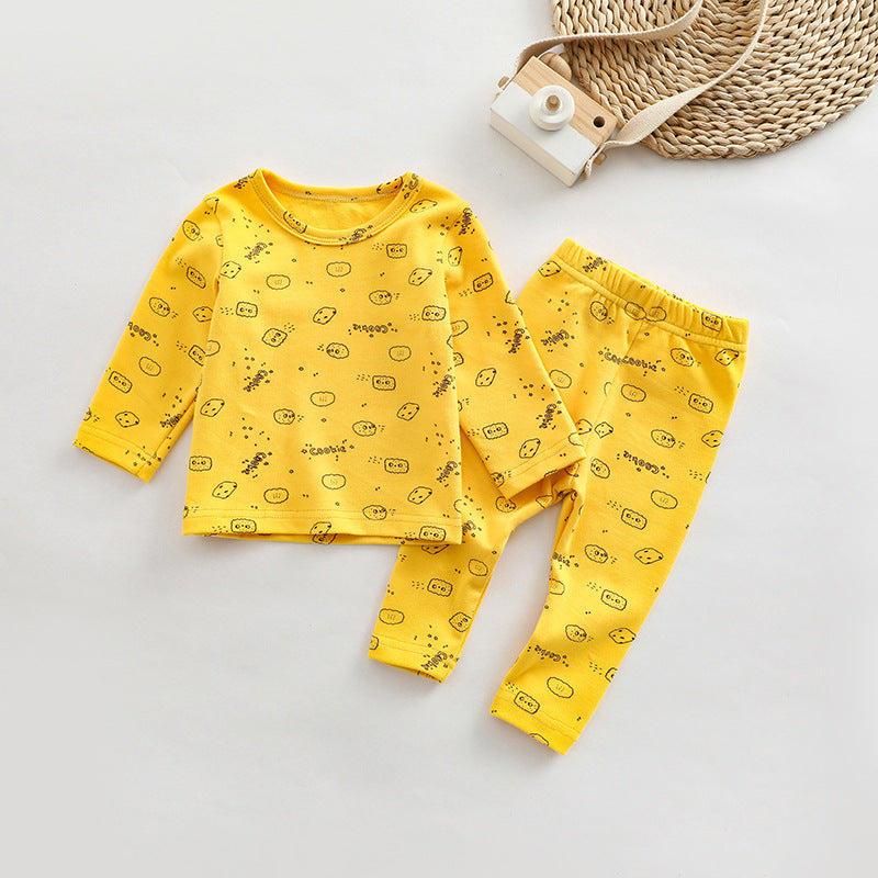 A cute baby outfit set featuring all-over print patterns in pink, yellow, and apricot colors, made from soft cotton material.