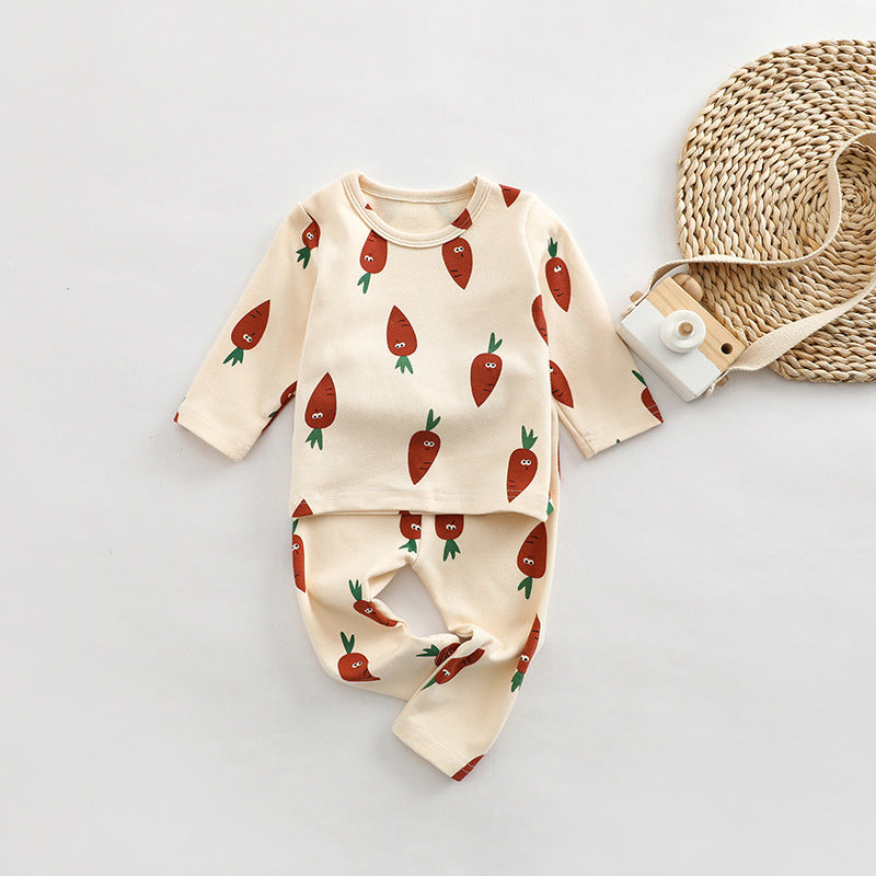 A cute baby outfit set featuring all-over print patterns in pink, yellow, and apricot colors, made from soft cotton material.