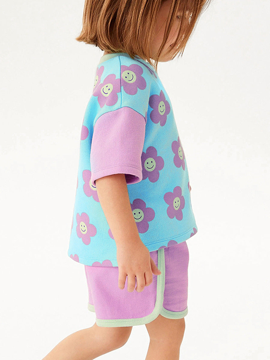 Baby and kids girls floral cartoon top and shorts set in purple, featuring vibrant floral and cartoon patterns, perfect for summer casual wear.