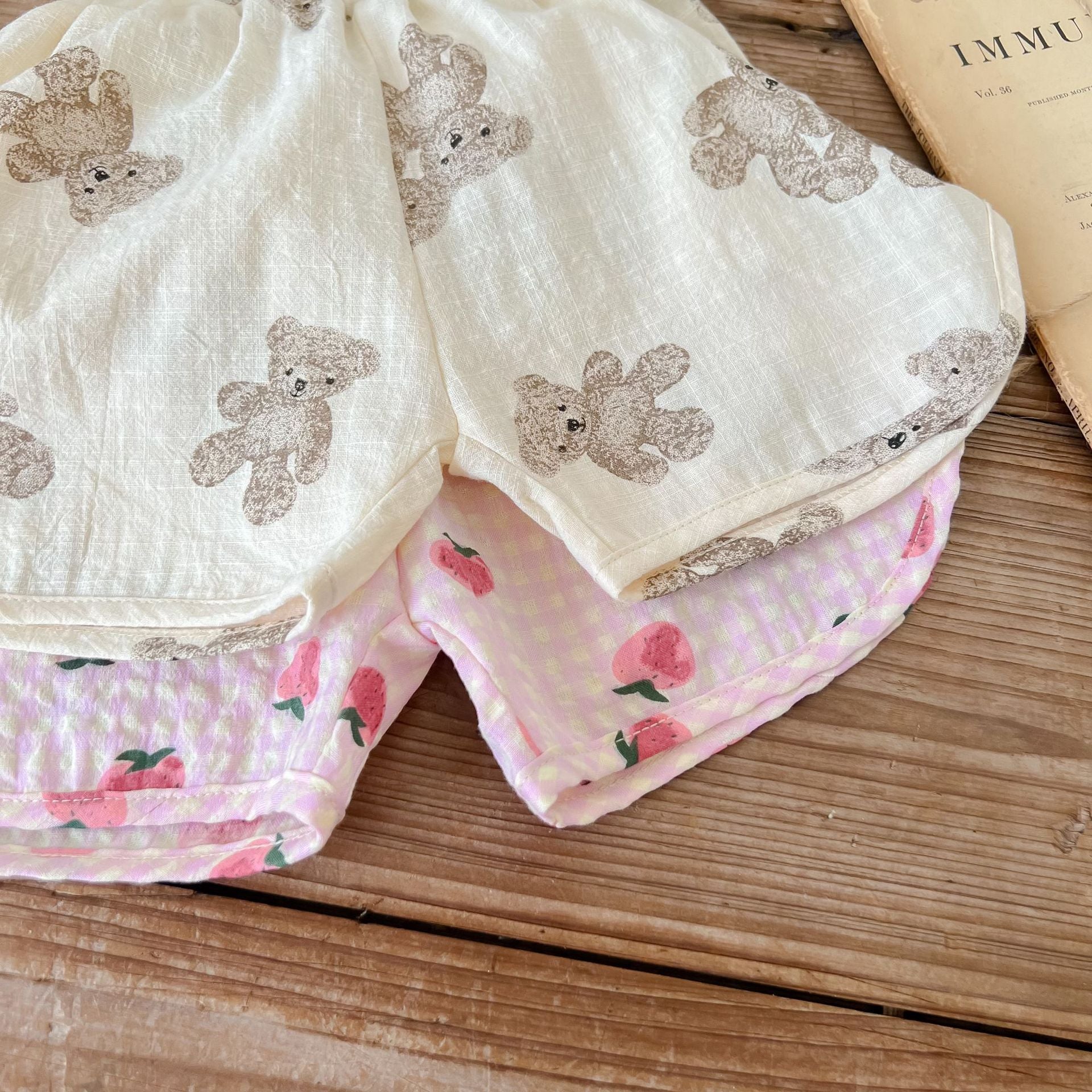 Baby animal print sling top and shorts set in pink and beige, featuring a stylish design for summer wear.