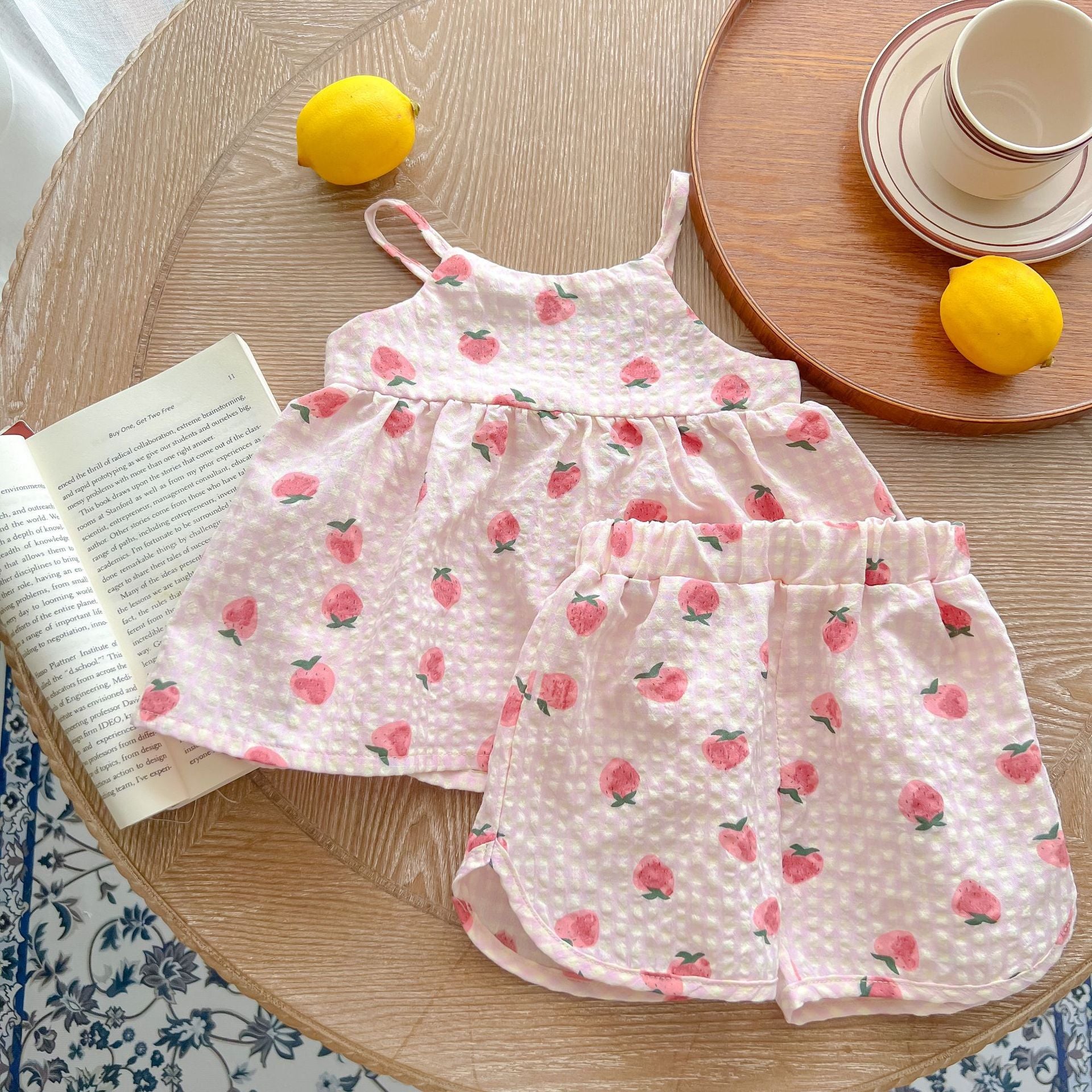 Baby animal print sling top and shorts set in pink and beige, featuring a stylish design for summer wear.