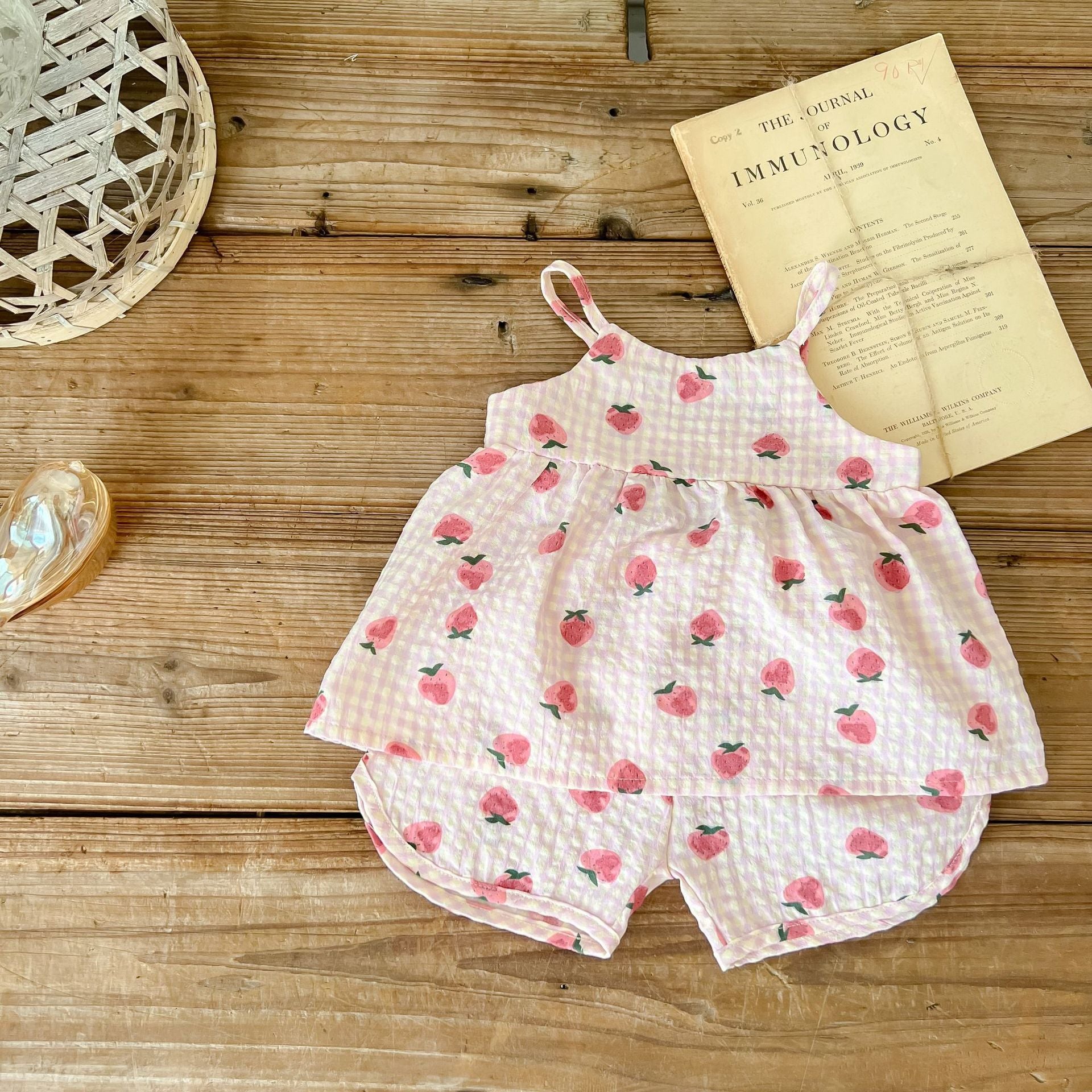 Baby animal print sling top and shorts set in pink and beige, featuring a stylish design for summer wear.