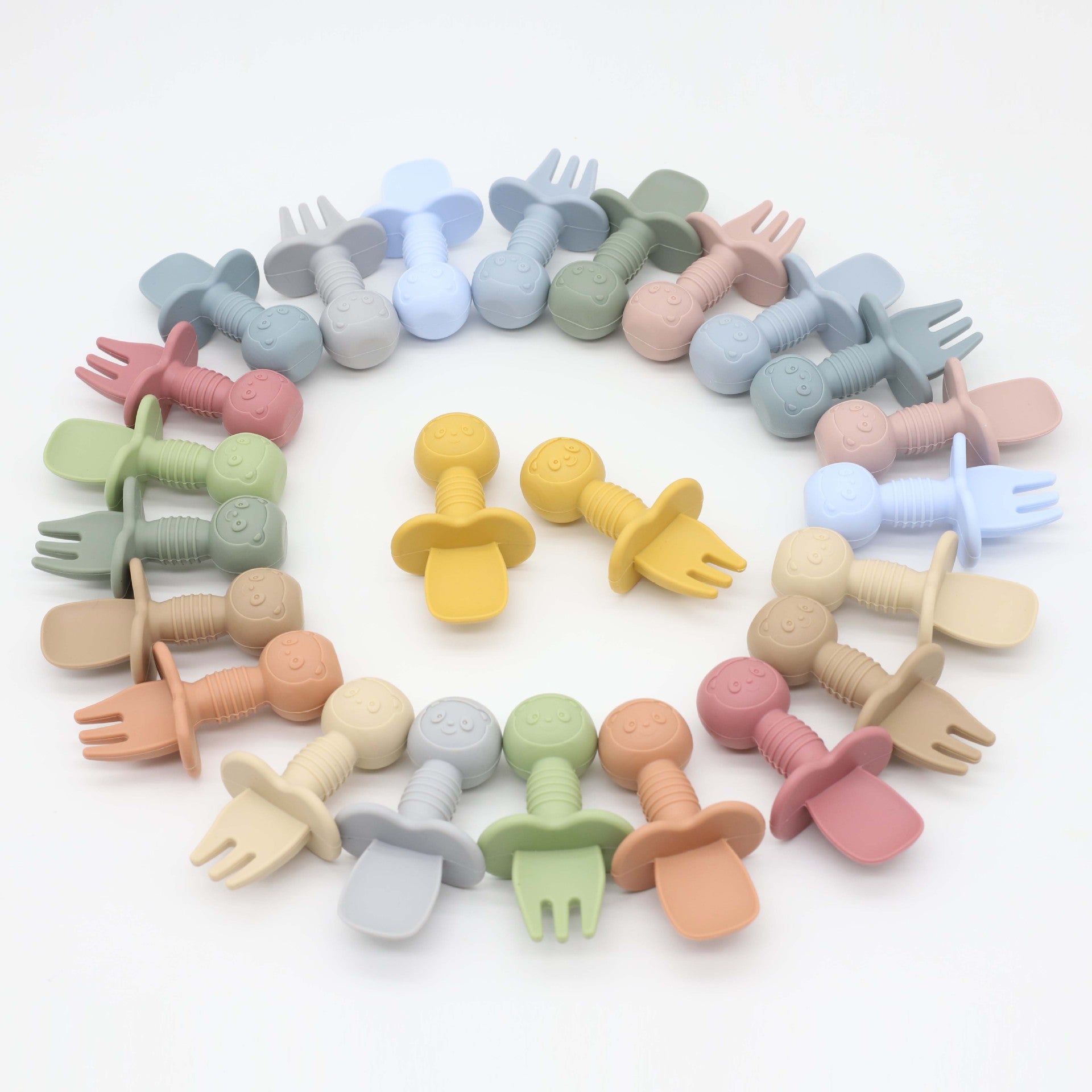 A colorful set of Baby Bear Pattern Silicone Spoons and Forks for children, featuring various colors and a cute bear design, perfect for training toddlers.