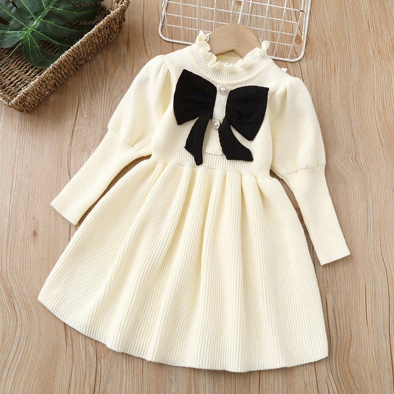 A beautiful Baby Bow Patched Design Puff Sleeve Princess Dress in white, featuring puff sleeves and a charming bow detail, perfect for little girls.