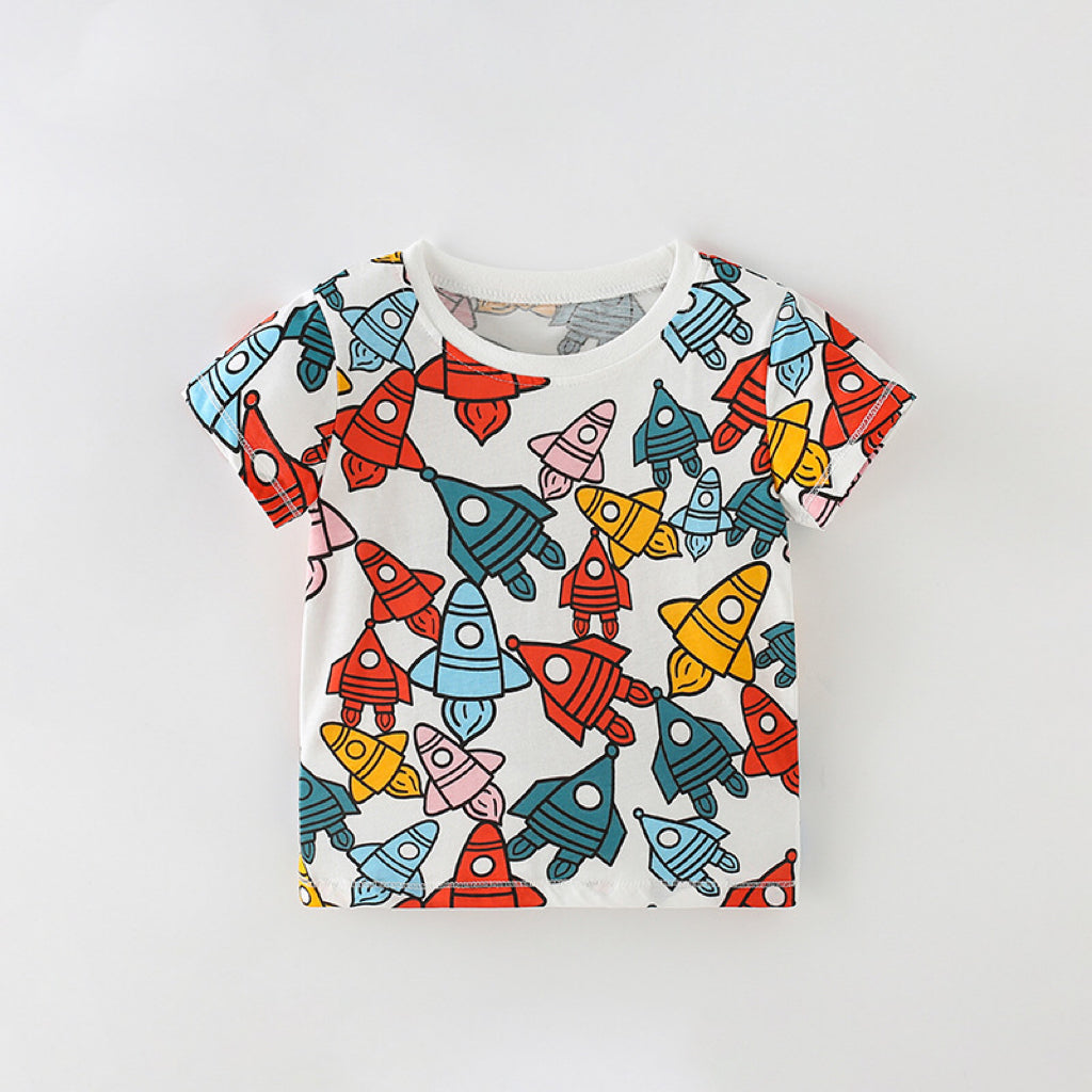 Baby boy's round neck tee featuring an all-over rocket pattern in white cotton fabric, perfect for summer wear.