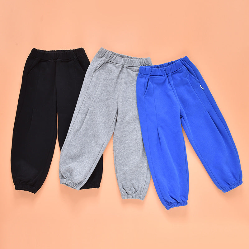 Baby boy and girl solid color loose casual pants in black, blue, and grey, made from soft cotton material, perfect for toddlers.