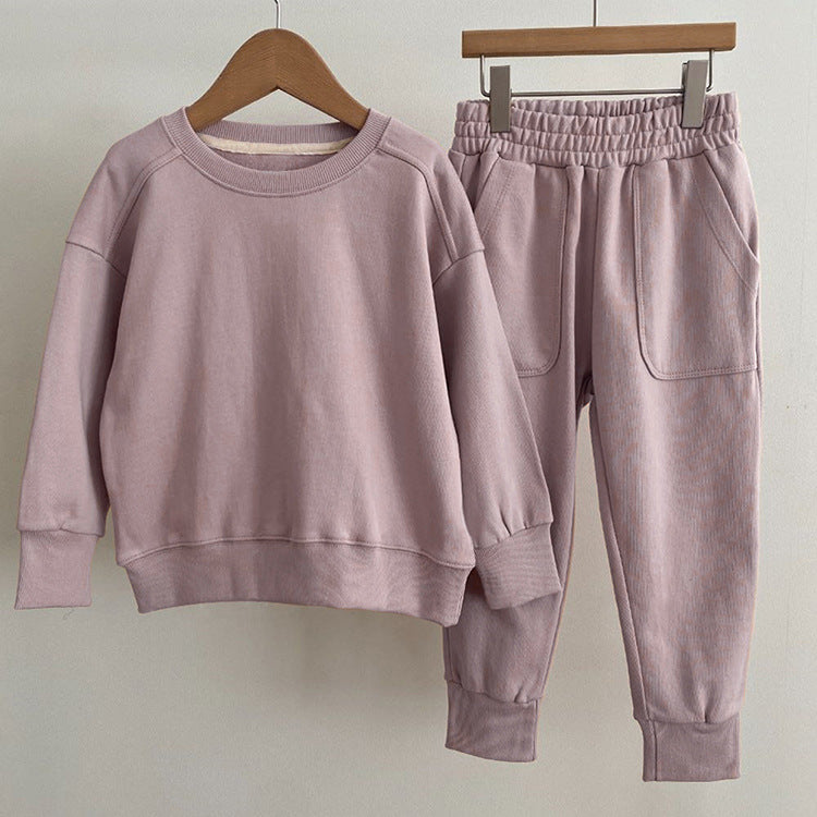 Baby boy and girl solid color pullover hoodies combo pants sets in pink, grey, and apricot, made from soft cotton for comfort.