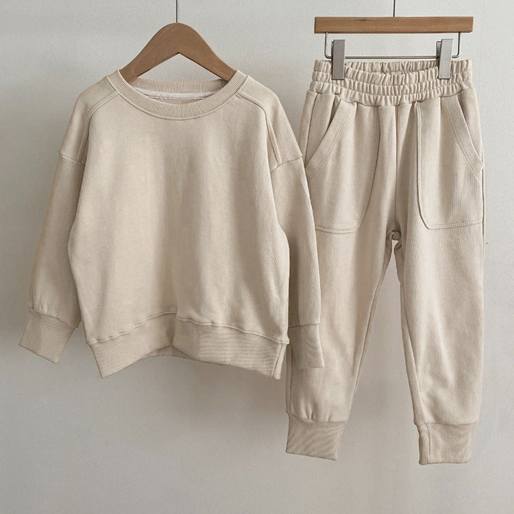 Baby boy and girl solid color pullover hoodies combo pants sets in pink, grey, and apricot, made from soft cotton for comfort.