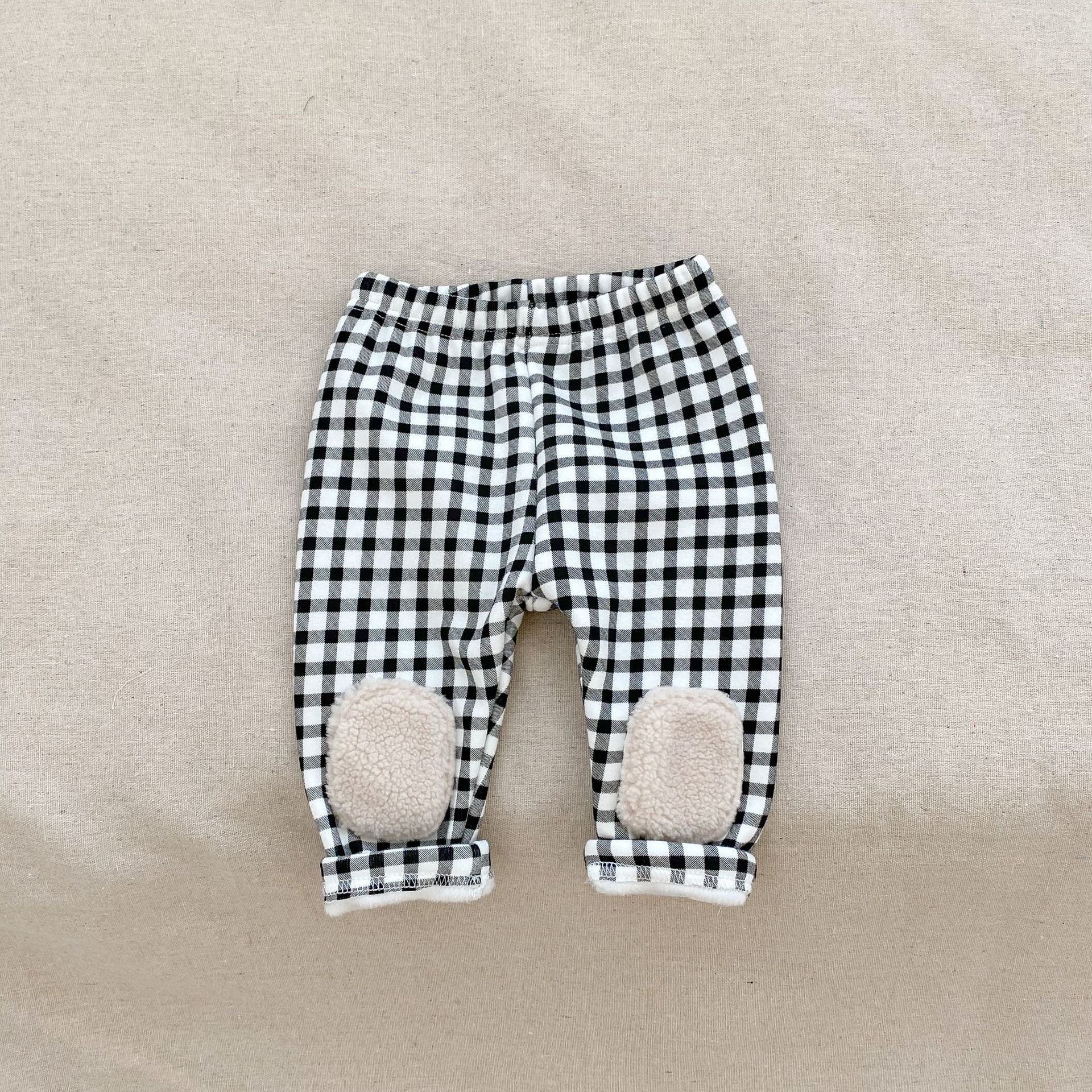 High waist thickened long pants for baby boys and girls in white and black colors, perfect for winter wear.