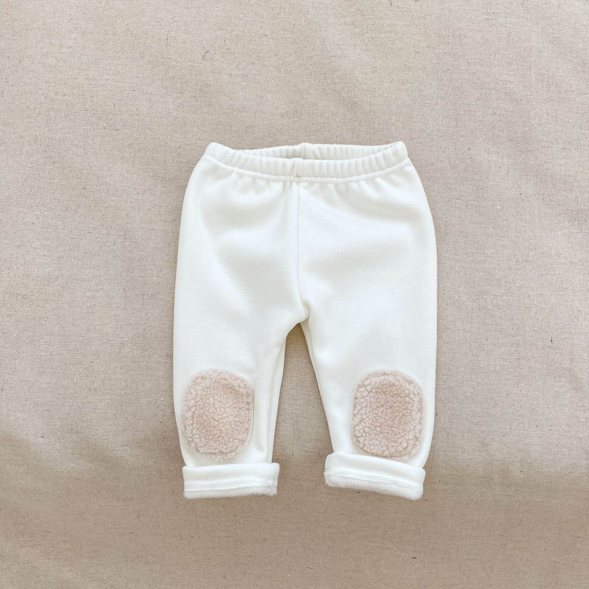 High waist thickened long pants for baby boys and girls in white and black colors, perfect for winter wear.