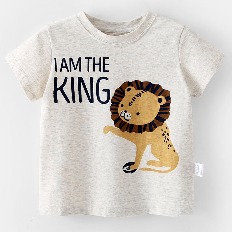 A playful baby boy wearing a loose animal print T-shirt in grey, perfect for summer adventures.